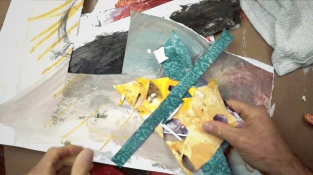 Showing off my handmade collage paper created with old drawings and excess acrylic paint.