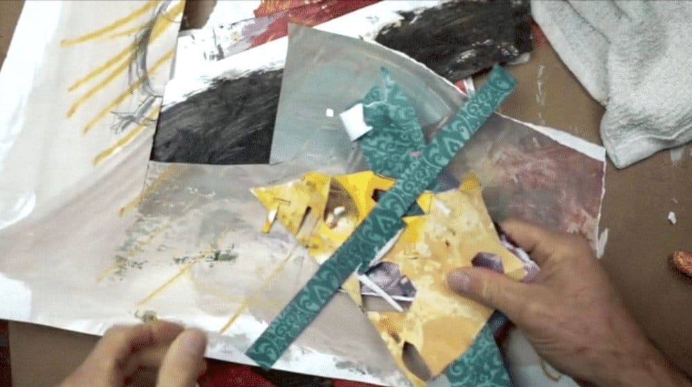 Collection of colorful handmade collage paper scraps used in creating an expressive mixed media still life.