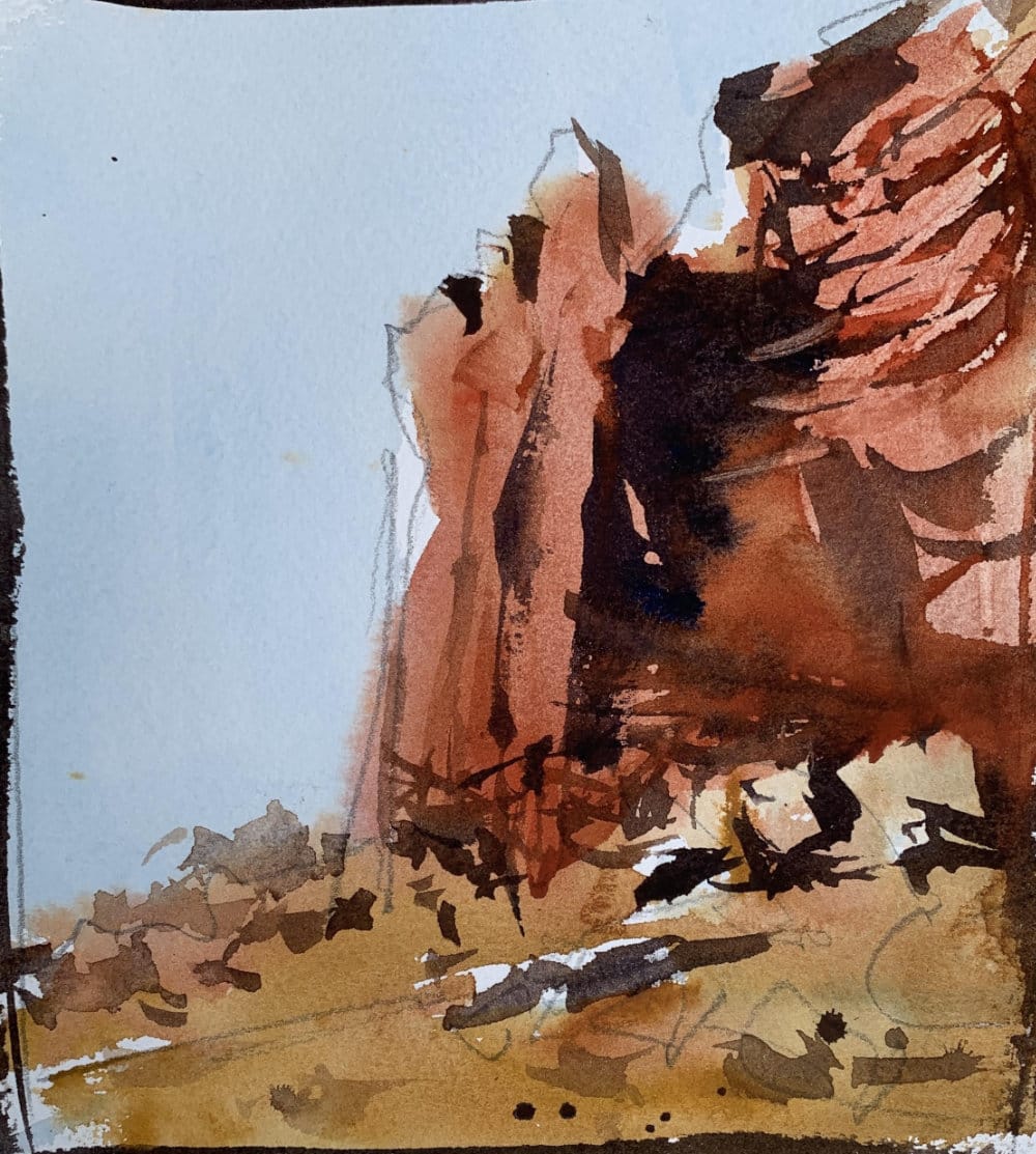 Watercolor tutorial for beginners on painting warm red desert rocks with bold color