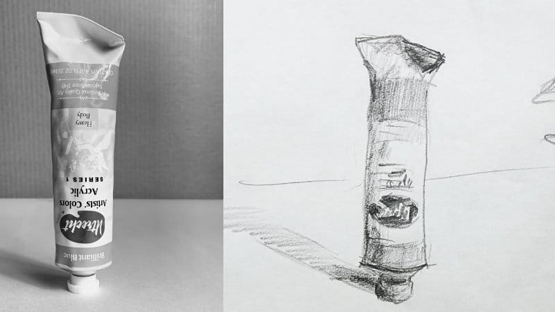 Photo reference of a paint tube next to the completed pencil drawing showing creases and highlights.