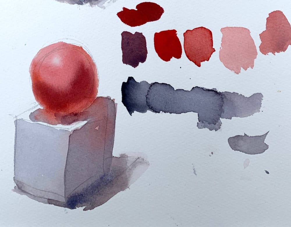Red watercolor sphere and white cube demonstration showing color interaction and reflected light techniques
