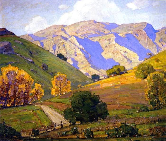 A sunlit road cutting through golden hills and violet mountains, showing angled planes and sunlight transitions.