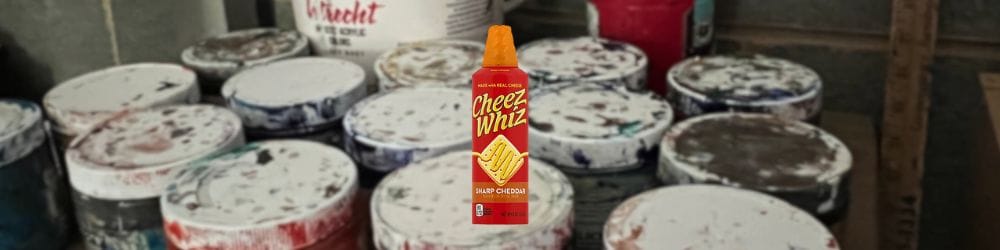 Close-up of acrylic paint on canvas with a Cheez-Whiz—hero for top acrylic paint guide.