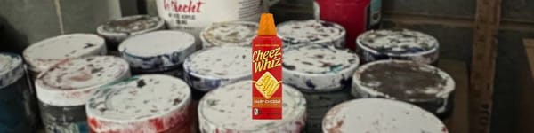 Close-up of acrylic paint on canvas with a Cheez-Whiz—hero for top acrylic paint guide.